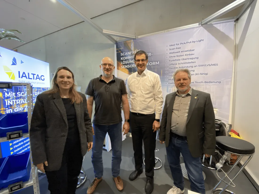 The IALTAG leadership team at a trade fair